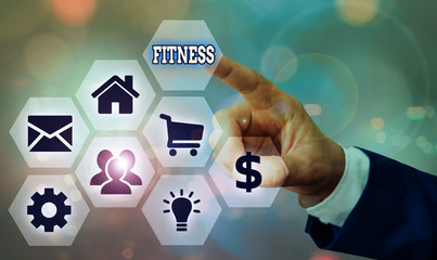 Conceptual hand writing showing Fitness. Concept meaning the state of health and wellbeing and the...