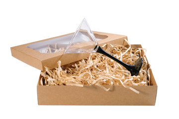Glassware and cardboard box isolated on a white background. Secure delivery service.