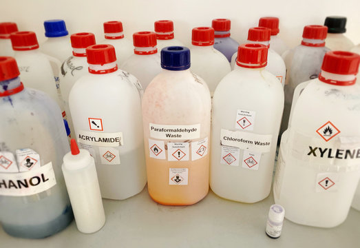 Liquid chemicals and waste bottles in a lab