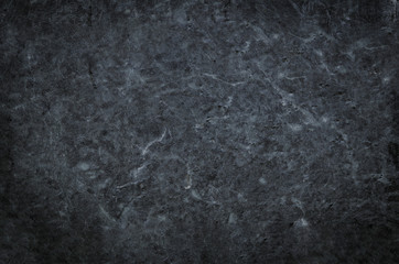 Plakat Natural black or dark stone background and texture for design.