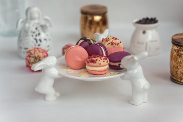 Macaron cake of different colors of large size in a beautiful layout on a light white background
