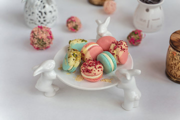 Macaron cake of different colors of large size in a beautiful layout on a light white background