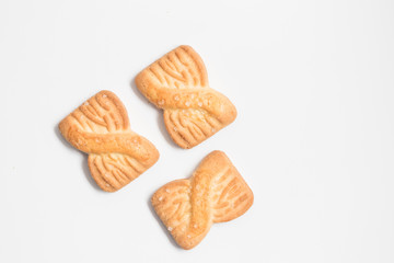 Cookies biscuits with sugar on top on white background in top view