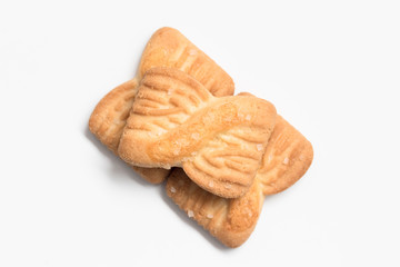 Freshly baked sugar cookies on white background in top view close up