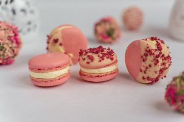 Macaron cake of different colors of large size in a beautiful layout on a light white background