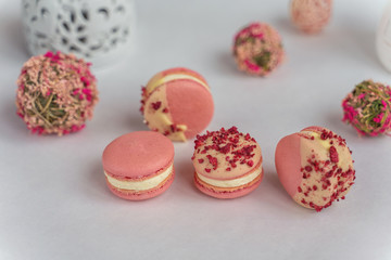 Macaron cake of different colors of large size in a beautiful layout on a light white background