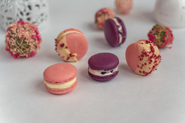 Macaron cake of different colors of large size in a beautiful layout on a light white background