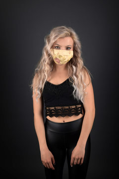 Beautiful sexy blonde woman with respirator mask