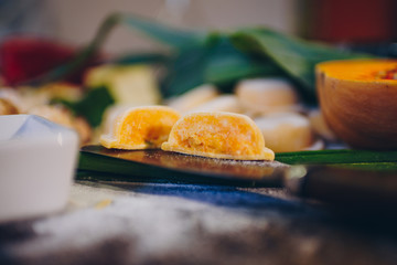 Fresh pasta, fruits and vegetables on wooden table