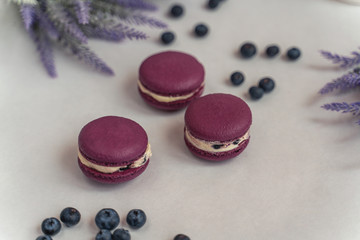 Macaron cake of different colors of large size in a beautiful layout on a light white background