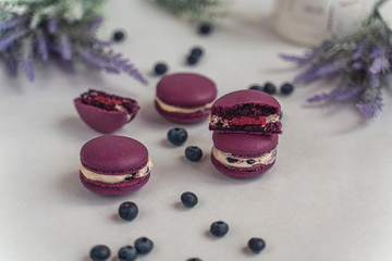 Macaron cake of different colors of large size in a beautiful layout on a light white background
