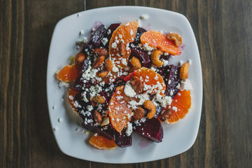 overhead photo of roasted beet salad with oranges and goat cheese