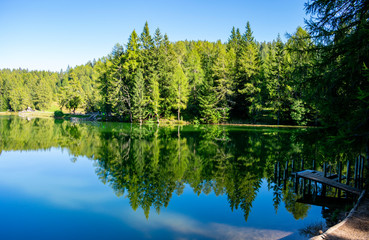 Fototapeta premium Italy, Trentino-Alto Adige/Südtirol - 15 september 2019 - An extraordinary reflection in the alpine lake of Santa Maria