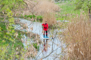 SUP silhouette sports man paddle boarding