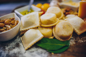 Fresh pasta, fruits and vegetables on wooden table