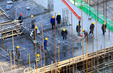 Many workers are working at the construction site