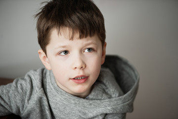 large portrait of a boy who grimaces, opens his mouth © Natallia Lipchanka