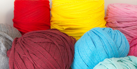 Beautiful composition of colored balls of fabric for knitting, needle and crafts