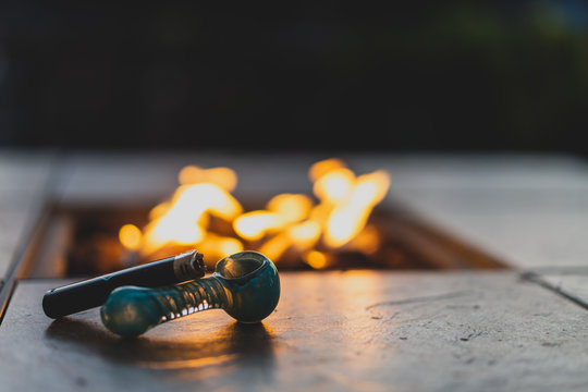 pipe and lighter by a fire
