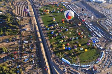 The balloon field is visible during the mass ascension of balloons into the air during the Albuquerque Balloon Fiesta that takes place in October each year drawing many visitors from around the world. © Tricia