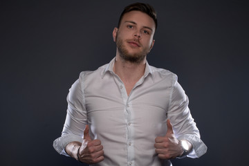 Fototapeta premium Portrait of beautiful man on grey background. Studio Isolated