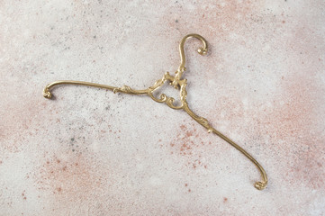 Antique brass clothes hanger
