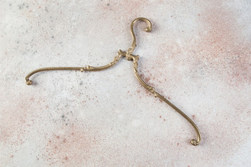 Antique brass clothes hanger