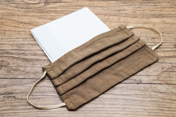 Still life of a red facial mask on a white background anti covid 19