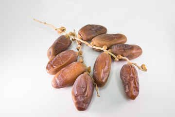 Dried dates on white background