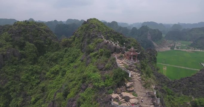Aerial view of Tam Coc Bich Dong, part of the Trang An Scenic Landscape Complex UNESCO World Heritage site, Ninh Binh. Tam Coc is a flooded cave karst system, Bich Dong is a series of moutain pagodas