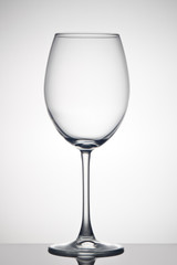 Empty glass for wine on gray background. Wineglass