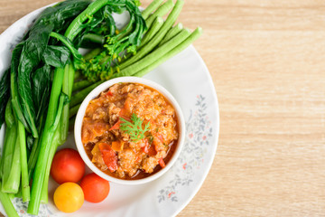 Northern Thai food (Nam Prik Ong), spicy chili minced pork with tomatoes eating with vegetables, Thai chili paste