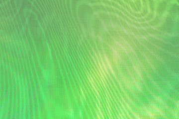abstract background: unique wavy overlay pattern of two grids, blurring and tinting in light yellowgreen color