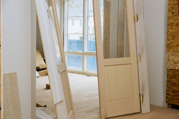 Interior wooden doors are waiting for installation in the house they built