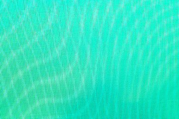 abstract background: unique wavy pattern of overlaying two grids, blurring and tinting in light emerald color