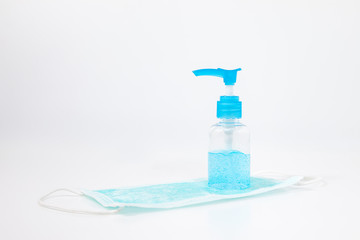 Close up Medical mask and alcohol gel on white background. Medical mask used for dust protection and very efficient filtration of airborne. hand hygiene corona virus protection.