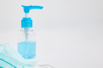 Close up Medical mask and alcohol gel on white background. Medical mask used for dust protection...