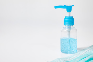 Close up Medical mask and alcohol gel on white background. Medical mask used for dust protection and very efficient filtration of airborne. hand hygiene corona virus protection.