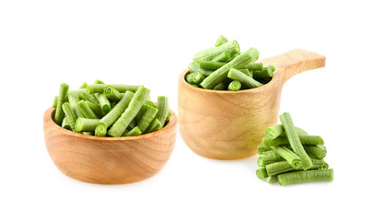 yardlong beans in wooden bowl on white background