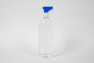 Bottle with blue dispenser filled moisturizing, cleansing or antiseptic liquid gel for hands, face and body stands on white background, copy space. Daily rituals of beauty and hygiene.