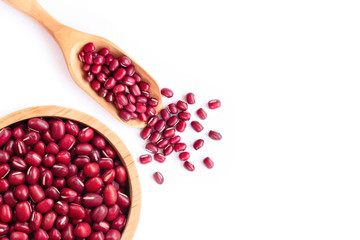 Red small Azuki beans ( Adzuki or japanese red bean ) in wooden bowl and scoop isolated on white background. Top view. Flat lay.