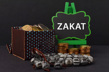 Islamic zakat concept. A contribution structure for Muslims or moslems to help the poor and needy. Conceptual shoot for property, income and fitrah zakat.