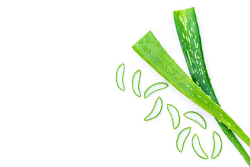 Green fresh aloe vera leaves and slices  isolated on white background. Top view.