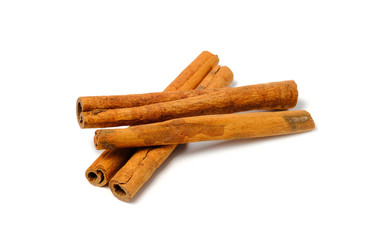 Cinnamon Sticks Stacked isolated on White background closeup macro shot