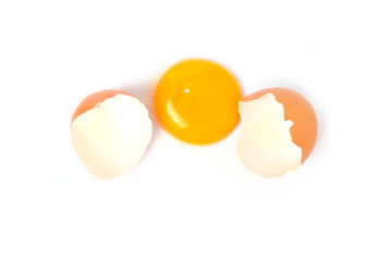 Chicken egg and half with yolk isolated on a white background.
