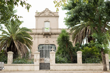 Fototapeta na wymiar Old mansion in one of the streets surrounding Plaza Artigas; in Carmelo, Uruguay