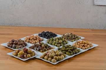 Olives assortment in bowl with oil. 