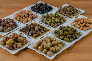 Olives assortment in bowl with oil. 