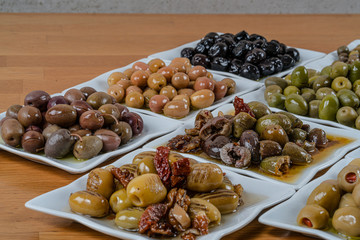 Olives assortment in bowl with oil. 