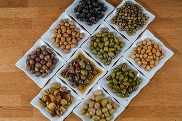 Olives assortment in bowl with oil. 